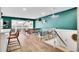 Bright living area with stairs, modern furniture, hardwood flooring, skylights, and vibrant accent walls at 4309 S Coors Ct, Morrison, CO 80465