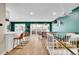 Inviting living area featuring hardwood floors, skylights, a ceiling fan, and a vibrant accent wall at 4309 S Coors Ct, Morrison, CO 80465