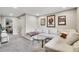 Comfortable living room with a sectional sofa, stylish coffee table, and movie posters at 4309 S Coors Ct, Morrison, CO 80465