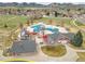 Aerial view of a community water park with splash pad, playground, green space, and picnic areas at 4309 S Coors Ct, Morrison, CO 80465