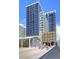 Modern high-rise with sleek architecture, pedestrian access, and visible public art installations at 1750 Wewatta St # 1536, Denver, CO 80202