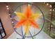 Unique view of a colorful star hanging from the ceiling, with overhead lighting, and a modern art installation at 1750 Wewatta St # 1536, Denver, CO 80202