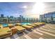 Stunning rooftop pool with lounge chairs and city views, perfect for relaxation and entertainment at 1750 Wewatta St # 1536, Denver, CO 80202