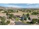 Panoramic aerial view of a luxurious neighborhood, featuring well-manicured lawns, mature trees, and scenic mountain vistas at 10985 Ambush Rock, Littleton, CO 80125