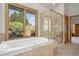 Large bathroom with window tub and separate walk-in shower at 10985 Ambush Rock, Littleton, CO 80125