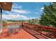 Spacious deck with outdoor seating and a fire pit, perfect for entertaining and enjoying the scenic views at 10985 Ambush Rock, Littleton, CO 80125