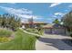 Beautiful single-story home featuring manicured landscaping, lush lawn and a three car garage at 10985 Ambush Rock, Littleton, CO 80125