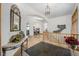 Bright foyer with gleaming hardwood floors, stone tiled entry, arched doorways, and staircase at 10985 Ambush Rock, Littleton, CO 80125