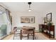 Dining area features sliding glass doors and modern light fixture at 1927 Pine St # B, Boulder, CO 80302