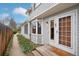 Charming home exterior with a cozy porch, bay window, and well-maintained landscaping at 1927 Pine St # B, Boulder, CO 80302