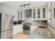 Modern kitchen features stainless appliances, granite countertops and white cabinets at 1927 Pine St # B, Boulder, CO 80302