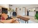 Cozy living room with a fireplace, wood floors and staircase at 1927 Pine St # B, Boulder, CO 80302