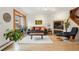 Bright living room boasts wood floors, fireplace, and ample natural light at 1927 Pine St # B, Boulder, CO 80302