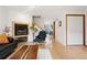 Open-concept living area features fireplace, wood floors, and natural light at 1927 Pine St # B, Boulder, CO 80302