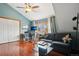 Cozy living room features a large window, hardwood floors, and a comfortable couch with stylish pillows at 1927 Pine St # B, Boulder, CO 80302
