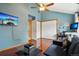 Comfortable living room with TV and large closet, perfect for relaxation and storage at 1927 Pine St # B, Boulder, CO 80302