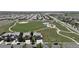 Aerial view of the property, highlighting its location near a park and green space at 15352 E 117Th Ave, Commerce City, CO 80022