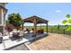Backyard patio with a charming wooden gazebo and outdoor furniture, great for relaxation at 15352 E 117Th Ave, Commerce City, CO 80022