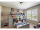 bedroom with a bunk bed, ladder, and whimsical decor at 15352 E 117Th Ave, Commerce City, CO 80022
