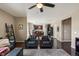 Spacious living room with dark wood floors, neutral walls and an open floorplan at 15352 E 117Th Ave, Commerce City, CO 80022