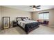 Serene main bedroom with a decorative bed frame, a window bench and carpeted floors at 15352 E 117Th Ave, Commerce City, CO 80022