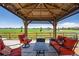 Cozy patio with comfortable seating, perfect for enjoying the outdoor views at 15352 E 117Th Ave, Commerce City, CO 80022