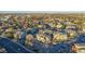 Wide aerial shot showcases a residential area with diverse housing and tree-lined streets at 919 S Dawson Way # 7, Aurora, CO 80012