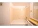 Cozy bathroom featuring a bathtub with standard shower head and neutral-toned tile surround at 919 S Dawson Way # 7, Aurora, CO 80012