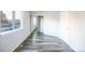 A bright bedroom featuring luxury vinyl flooring and a mirrored closet at 919 S Dawson Way # 7, Aurora, CO 80012
