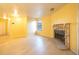 A bright open living area with light hardwood floors and a stone fireplace at 919 S Dawson Way # 7, Aurora, CO 80012