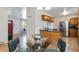 Bright dining room with hardwood floors flows into kitchen and living spaces at 5593 E Center Ave, Denver, CO 80246
