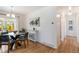 Light filled dining room with sliding door access to backyard patio at 5593 E Center Ave, Denver, CO 80246