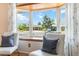 Living room bay window view with a comfortable seating and a view at 5593 E Center Ave, Denver, CO 80246
