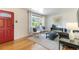 Cozy living room featuring a large bay window with seating and stylish decor at 5593 E Center Ave, Denver, CO 80246