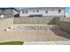 The backyard features a rock garden, a retaining wall, and a tall fence at 17673 Brass Buckle Way, Monument, CO 80132