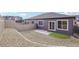 Backyard features rock garden, artificial lawn, concrete patio, and privacy fence at 17673 Brass Buckle Way, Monument, CO 80132