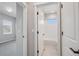 Modern bathroom featuring white subway tile, a tub and shower combo, and neutral gray walls at 17673 Brass Buckle Way, Monument, CO 80132