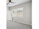 Well-lit room featuring neutral walls, plush carpeting, and a large window at 17673 Brass Buckle Way, Monument, CO 80132