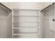 Empty closet featuring white shelving and rod, ready to be organized at 17673 Brass Buckle Way, Monument, CO 80132