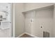 This laundry room has a utility sink, overhead shelf, and washer/dryer hookups at 17673 Brass Buckle Way, Monument, CO 80132
