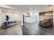 Spacious basement area featuring an exercise bench, storage, and a comfortable recliner at 2904 S Idalia St, Aurora, CO 80013