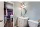 Bathroom with vanity, toilet and mirror that looks into a bedroom area at 2904 S Idalia St, Aurora, CO 80013