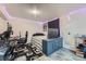Well-lit room with gaming setup, LED lights, light wood floors, and a dark accent rug at 2904 S Idalia St, Aurora, CO 80013