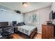 Bedroom setup with desk, chair, bed and tv at 2904 S Idalia St, Aurora, CO 80013