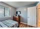 Small bedroom includes wood floors, window and dresser at 2904 S Idalia St, Aurora, CO 80013
