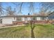 Charming single-story home with a well-manicured lawn, brick accents, and an attached garage at 2904 S Idalia St, Aurora, CO 80013