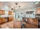 Well-lit kitchen with wooden cabinets, stainless steel appliances, and an island at 2904 S Idalia St, Aurora, CO 80013
