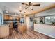 Open concept kitchen with stainless steel appliances, an island, and wood accents at 2904 S Idalia St, Aurora, CO 80013