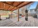 Covered wooden patio with grill and outdoor seating at 2904 S Idalia St, Aurora, CO 80013