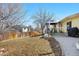 Backyard featuring patio area with dining set under a gazebo, grassy yard, and mature trees at 8612 S Everett Ct, Littleton, CO 80128